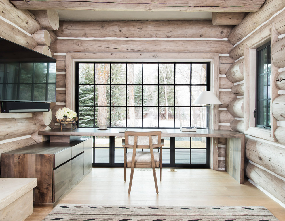 Photo of a rustic study in Denver with light hardwood flooring, no fireplace and a built-in desk.