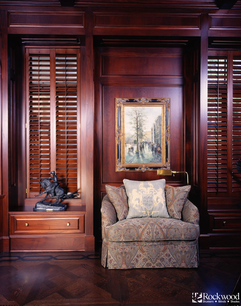 This is an example of a classic study in Birmingham with dark hardwood flooring.