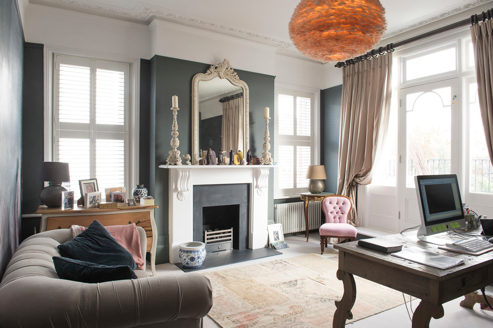 Design ideas for a classic home studio in London with grey walls, a standard fireplace, a metal fireplace surround, a freestanding desk, grey floors and a chimney breast.