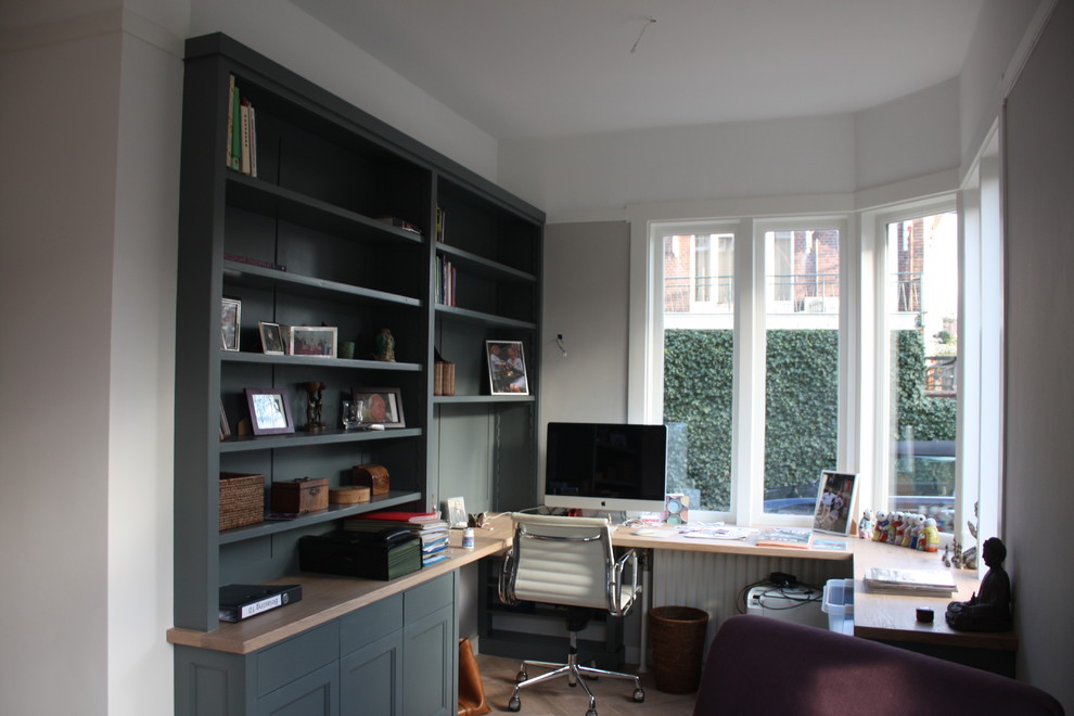 Example of an eclectic home office design in Amsterdam