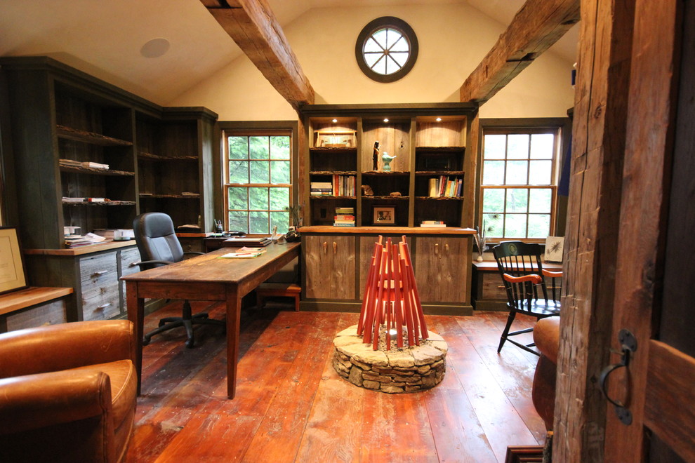 Inspiration for a rustic study in New York with beige walls, medium hardwood flooring and a freestanding desk.