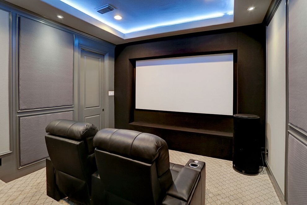 Example of a huge trendy carpeted and beige floor home theater design in Houston with gray walls and a projector screen