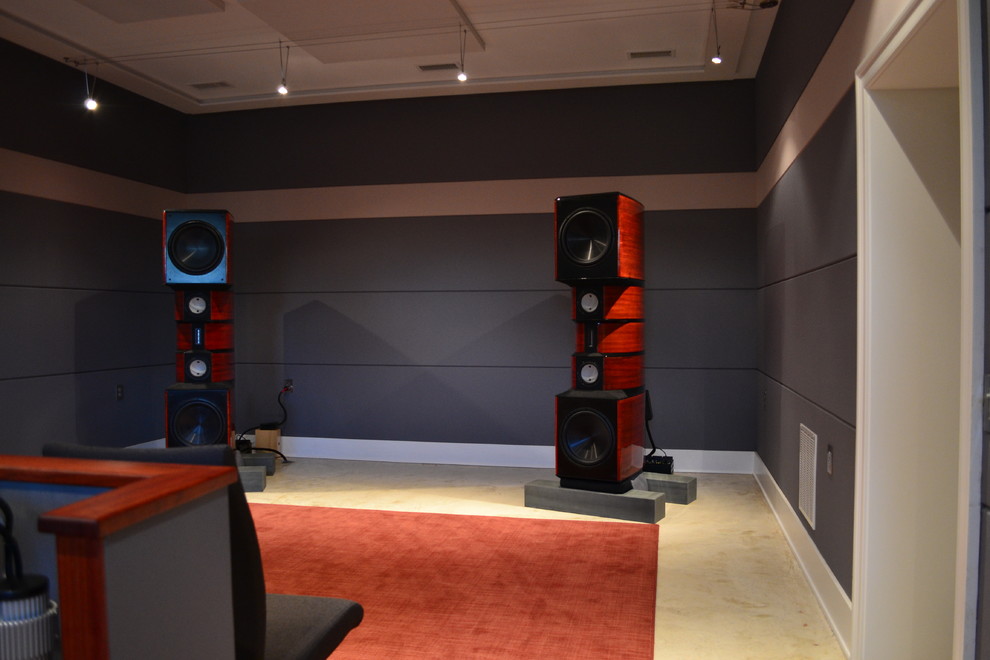 This is an example of a large contemporary enclosed home cinema in Philadelphia with grey walls and concrete flooring.