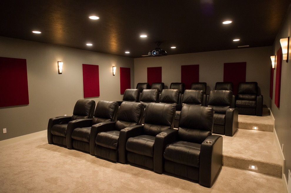 Inspiration for a large modern home cinema in Cleveland with beige walls and carpet.