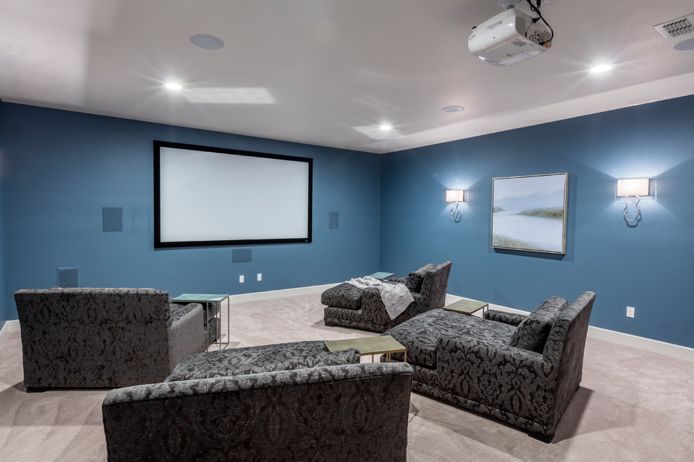 Large mountain style enclosed carpeted home theater photo in Austin with blue walls and a projector screen