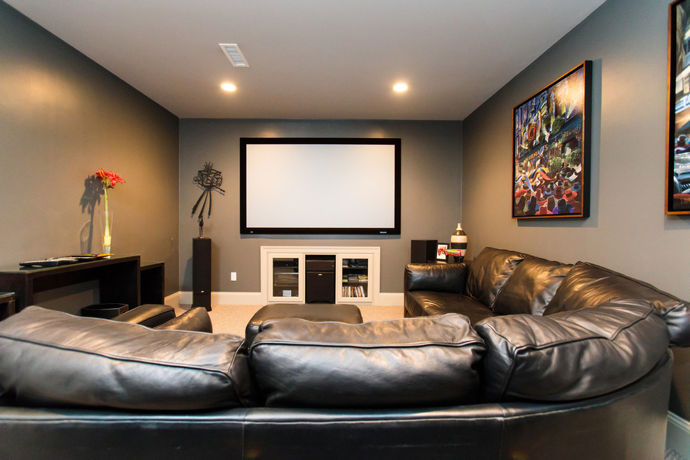 Inspiration for an expansive traditional enclosed home cinema in Boston with grey walls and a wall mounted tv.