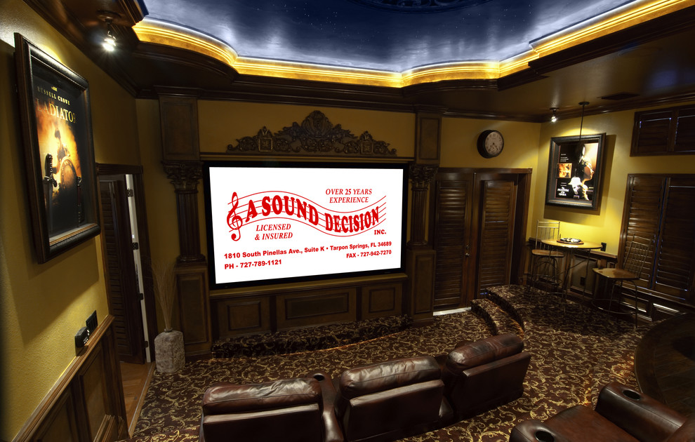 Large tuscan open concept carpeted home theater photo in Tampa with multicolored walls and a projector screen