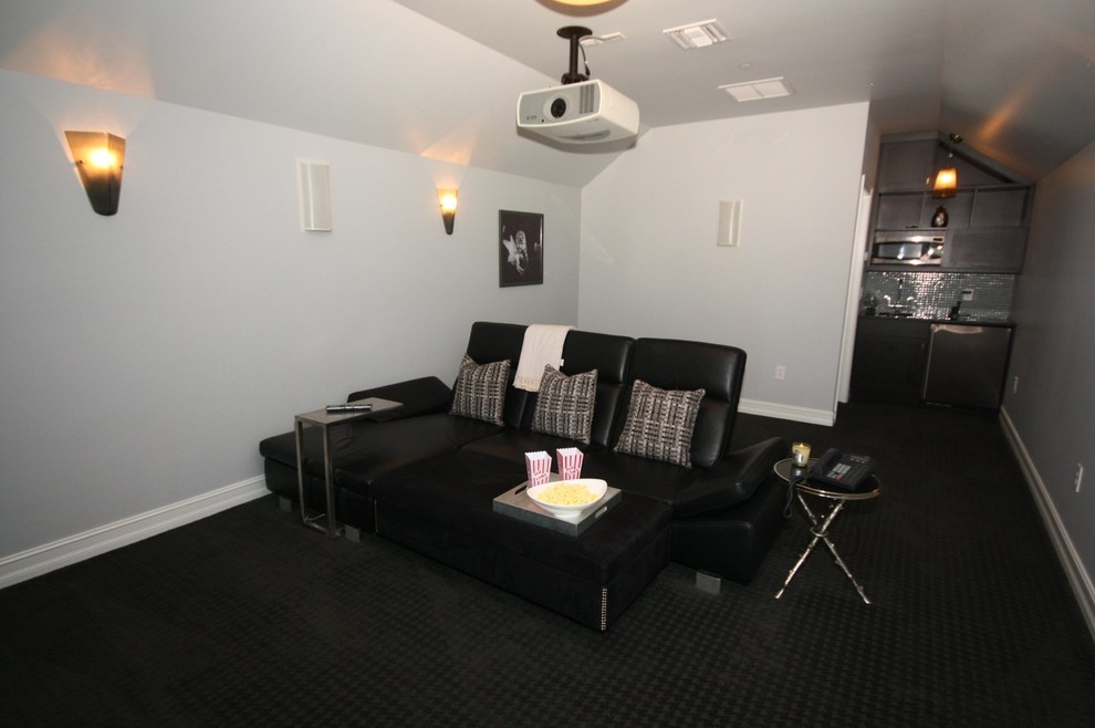Home theater - mid-sized traditional open concept carpeted and black floor home theater idea in Orlando with white walls