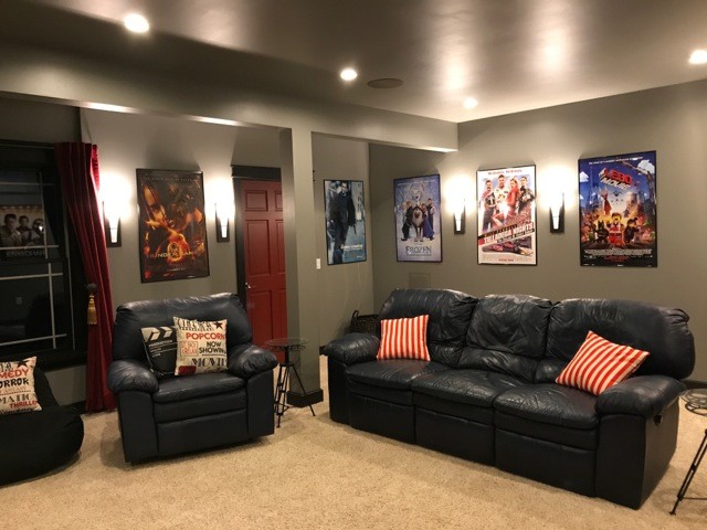 Inspiration for a mid-sized transitional open concept carpeted and beige floor home theater remodel in New York with beige walls and a wall-mounted tv