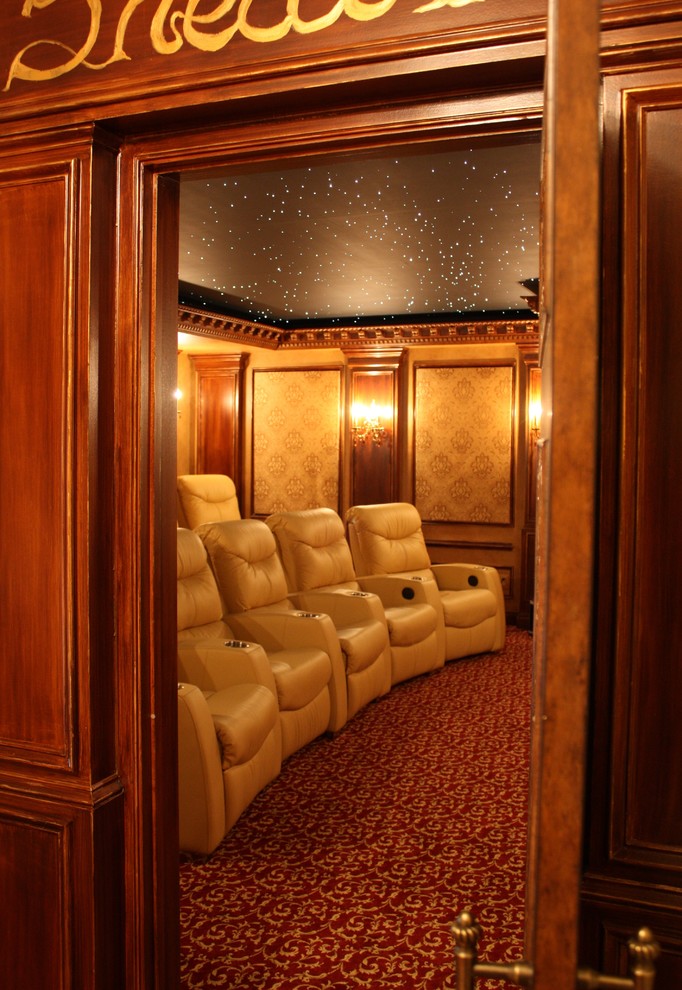Inspiration for a large timeless enclosed home theater remodel in DC Metro with beige walls and a projector screen