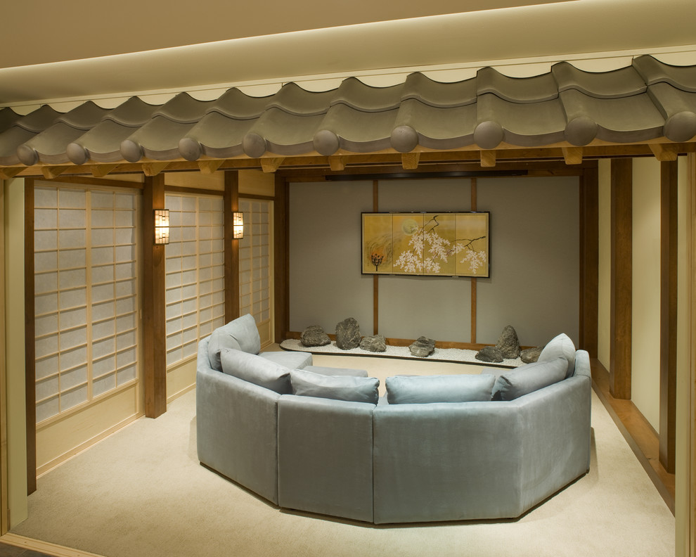 Example of a zen home theater design in Philadelphia with a projector screen