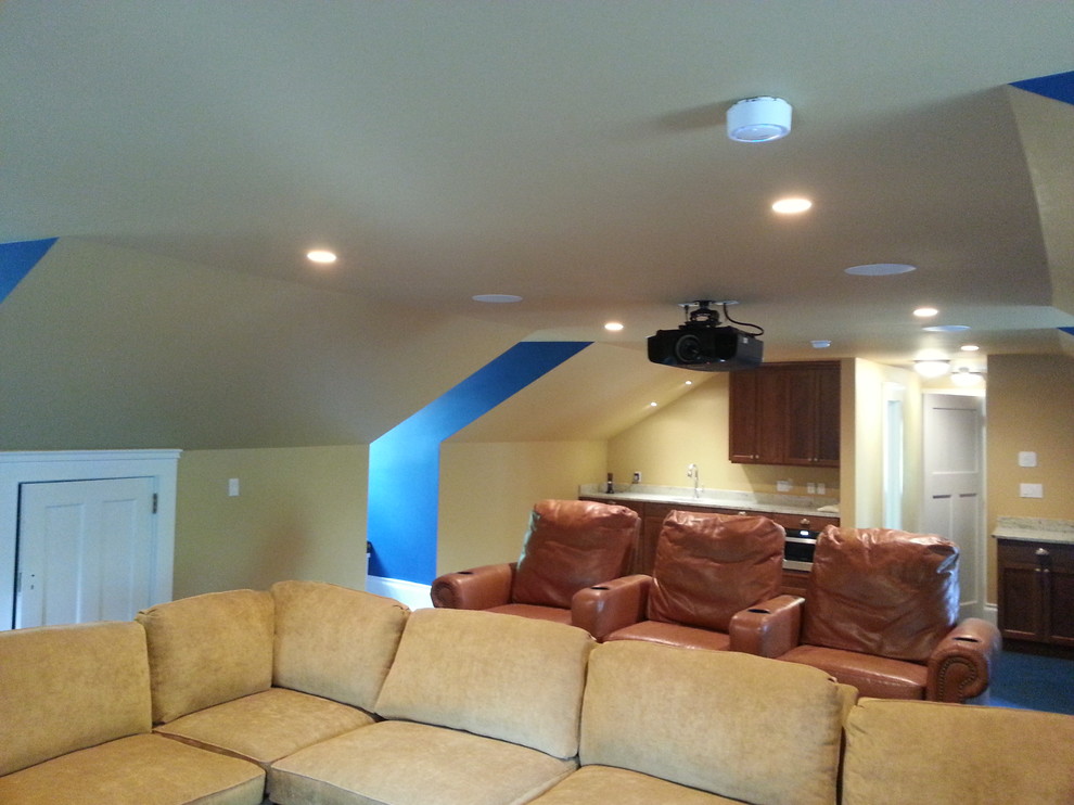 Design ideas for a medium sized classic home cinema in Cleveland with beige walls and a projector screen.