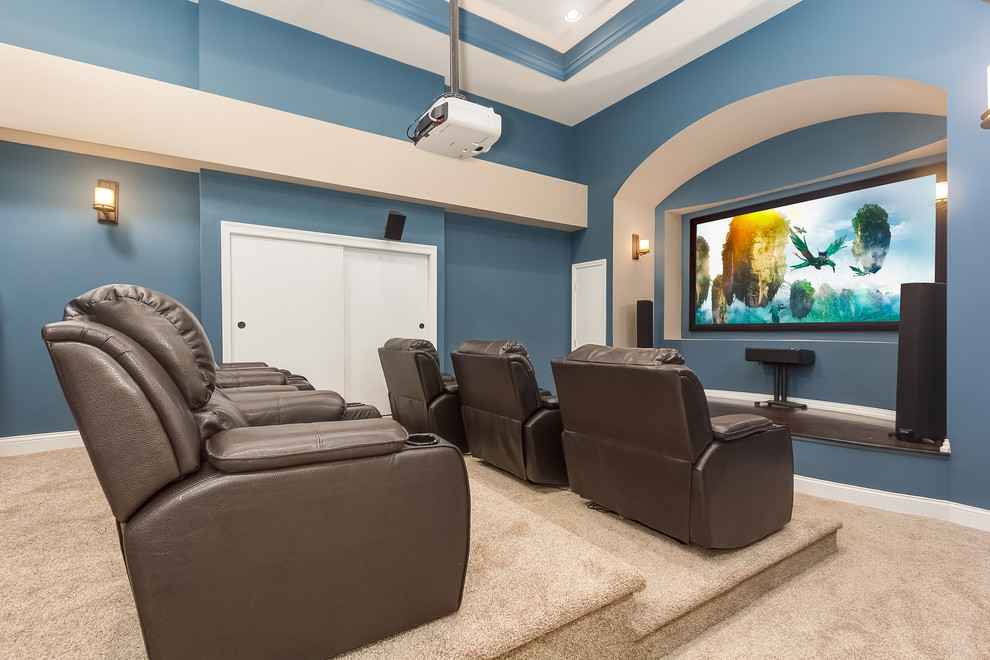 Home theater - mid-sized transitional enclosed carpeted and beige floor home theater idea in Chicago with blue walls and a projector screen