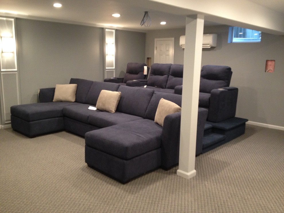 Home theater - large contemporary enclosed carpeted home theater idea in New York with gray walls and a projector screen
