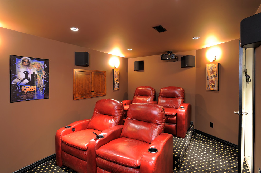 Example of a mid-sized trendy enclosed carpeted and multicolored floor home theater design in Vancouver with brown walls and a media wall
