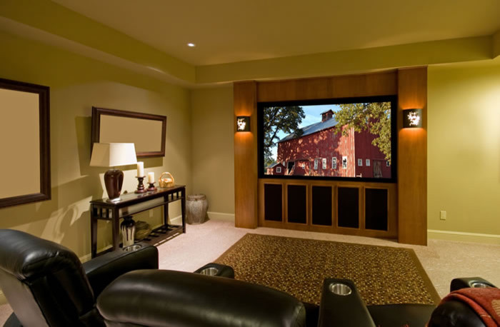 Photo of a medium sized traditional enclosed home cinema in Chicago with beige walls, carpet, a built-in media unit and beige floors.