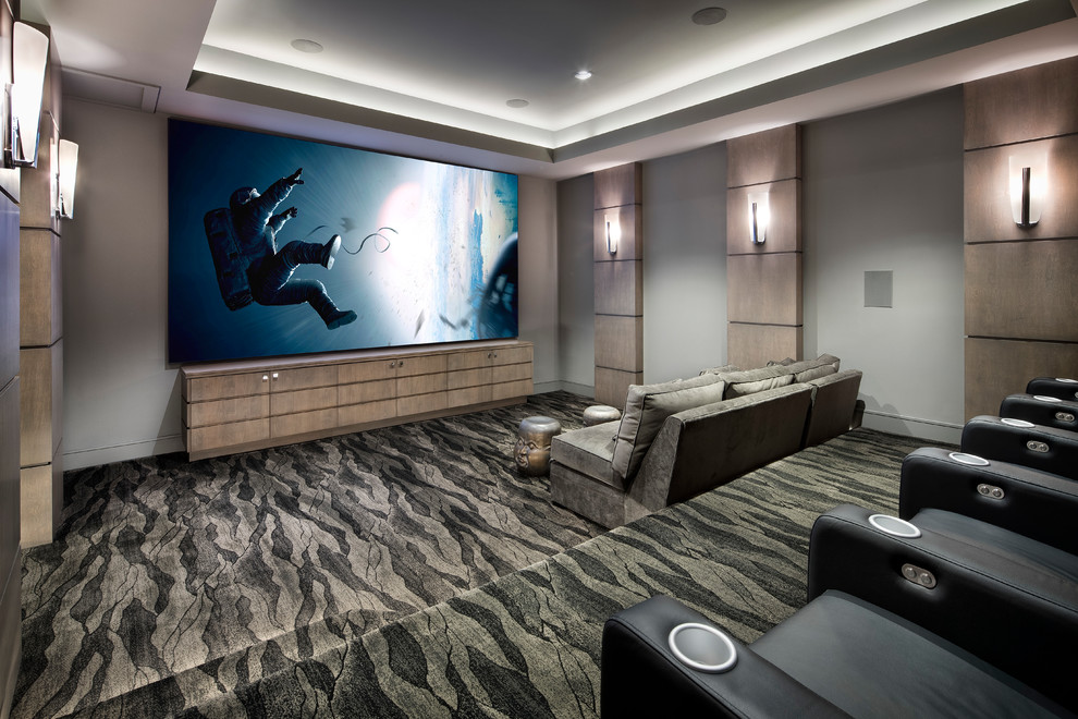 Inspiration for a huge contemporary enclosed home theater remodel in Houston with a projector screen