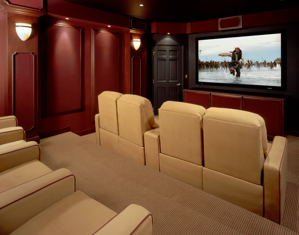 Example of a large classic enclosed carpeted and multicolored floor home theater design in New York with red walls and a projector screen