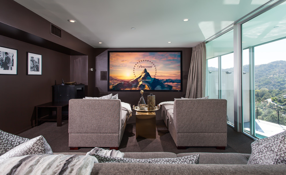 This is an example of a contemporary enclosed home cinema in Orange County with grey walls, carpet, a built-in media unit and grey floors.