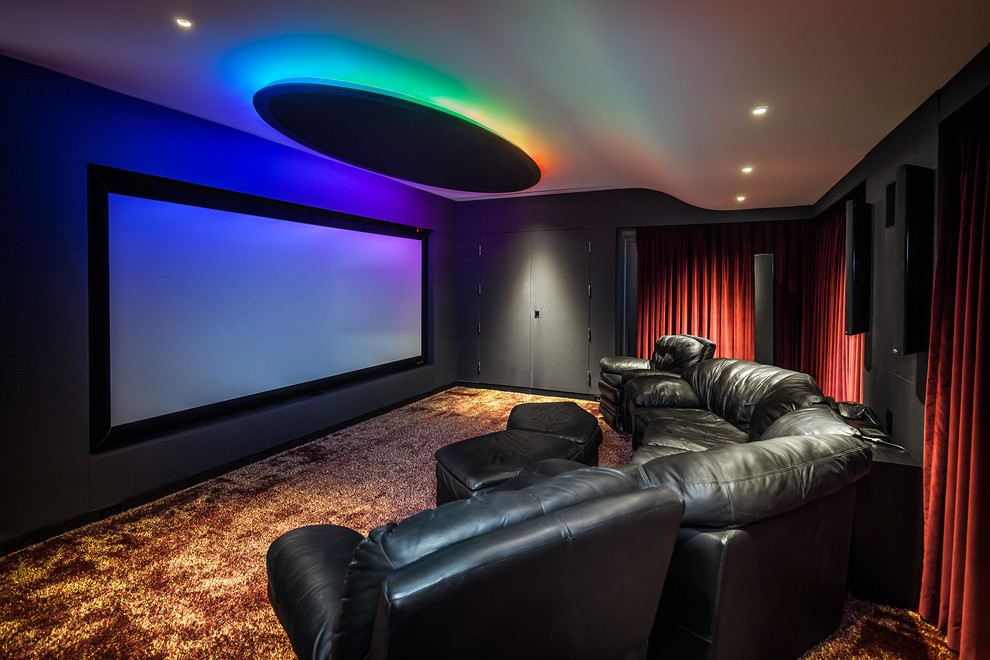 Contemporary enclosed home cinema in San Francisco with black walls and a projector screen.