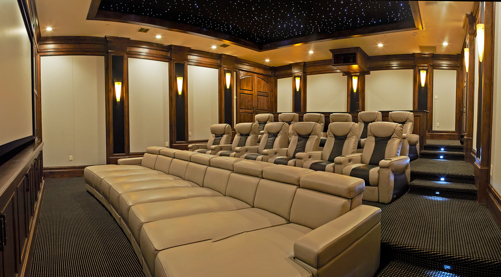 Home theater - large transitional enclosed carpeted home theater idea in Austin with beige walls and a projector screen