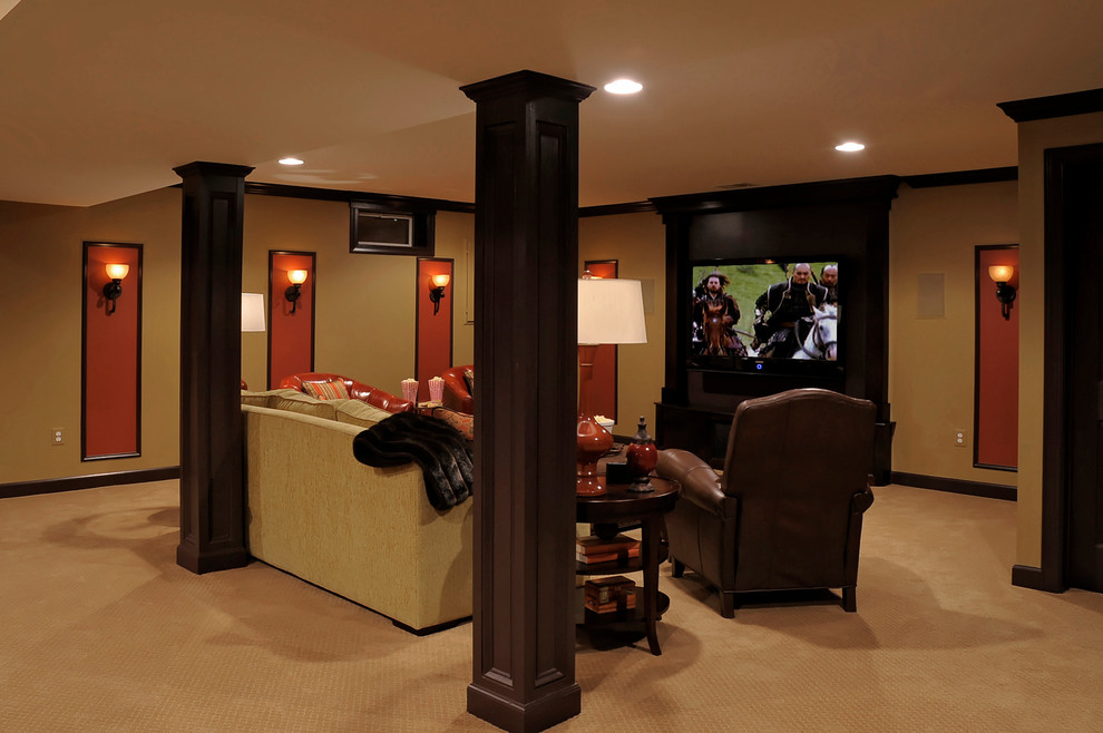 Home theater - large traditional enclosed carpeted home theater idea in DC Metro with beige walls and a media wall