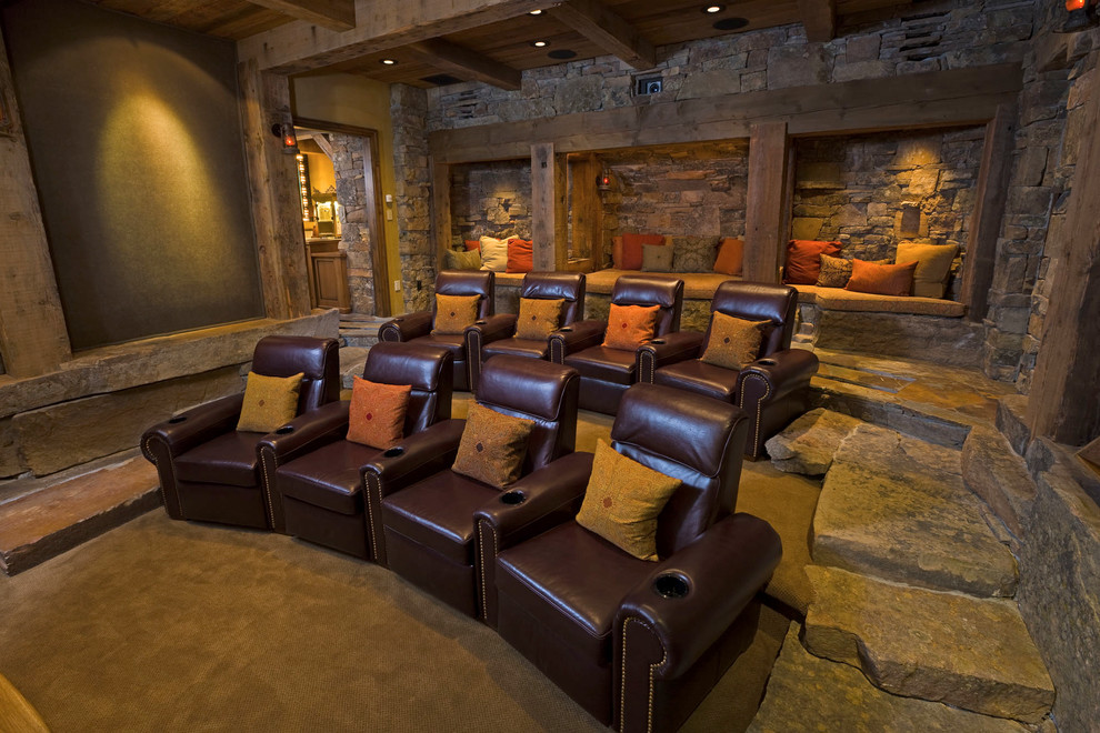 Mountain style enclosed home theater photo in Other with a projector screen