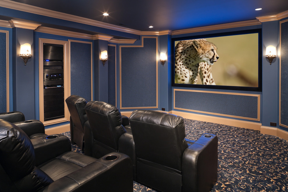 This is an example of a medium sized contemporary enclosed home cinema in Los Angeles with blue walls, a built-in media unit, carpet and multi-coloured floors.