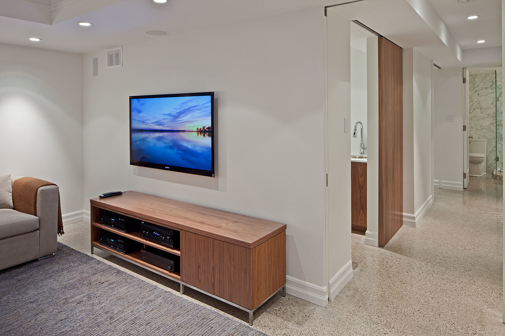 Medium sized contemporary home cinema in Toronto with white walls, concrete flooring and a wall mounted tv.