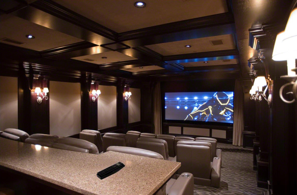 Large elegant enclosed carpeted home theater photo in Other with beige walls and a projector screen