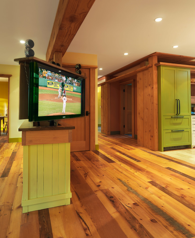 Design ideas for a large rustic open plan home cinema in Burlington with beige walls, dark hardwood flooring and a built-in media unit.