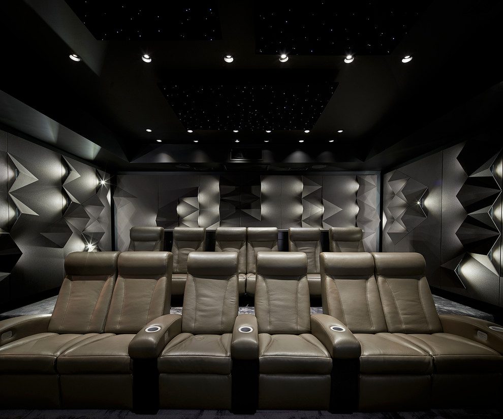 Inspiration for a large contemporary enclosed home cinema in New York with grey walls, carpet, a projector screen and grey floors.