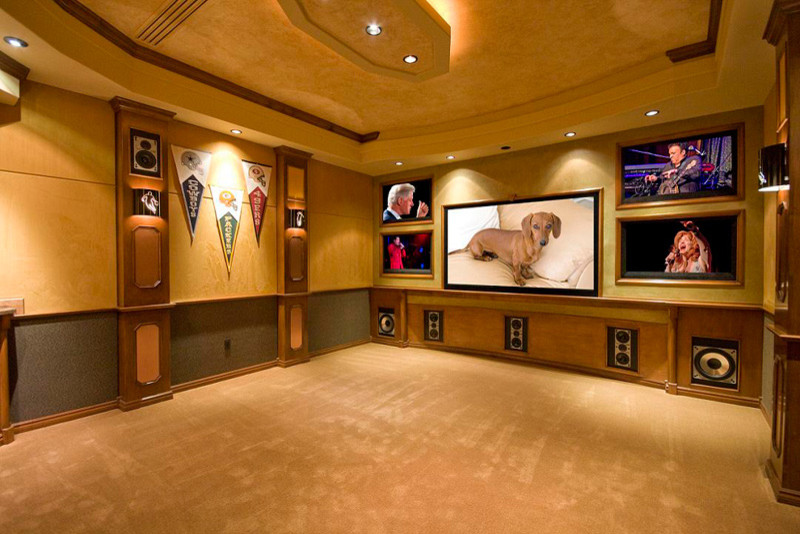 Home theater - mid-sized contemporary enclosed carpeted home theater idea in Tampa with multicolored walls and a projector screen