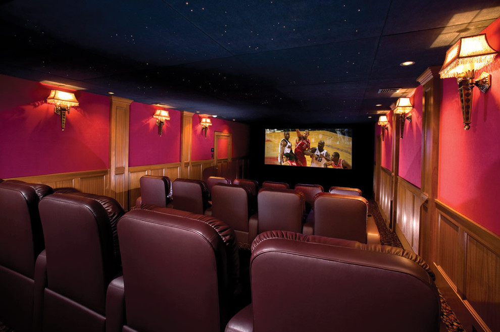 Home theater - contemporary home theater idea in New York with red walls