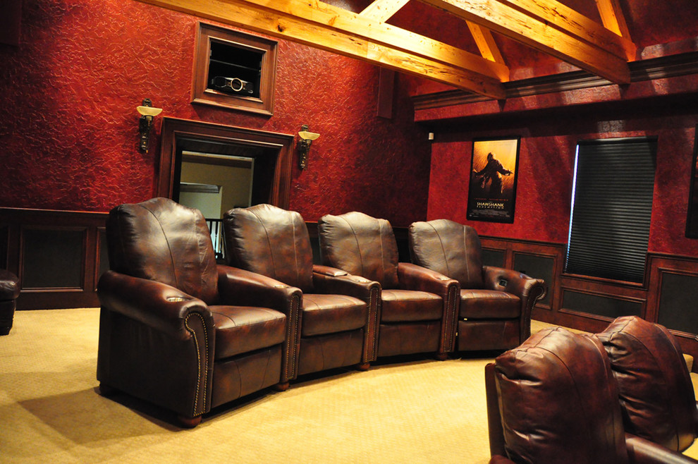 Mid-sized elegant enclosed carpeted home theater photo in Oklahoma City with red walls and a projector screen