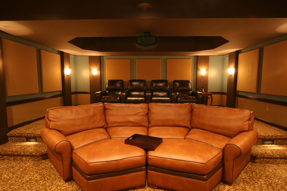 Example of a huge classic carpeted home theater design in Oklahoma City with multicolored walls and a projector screen