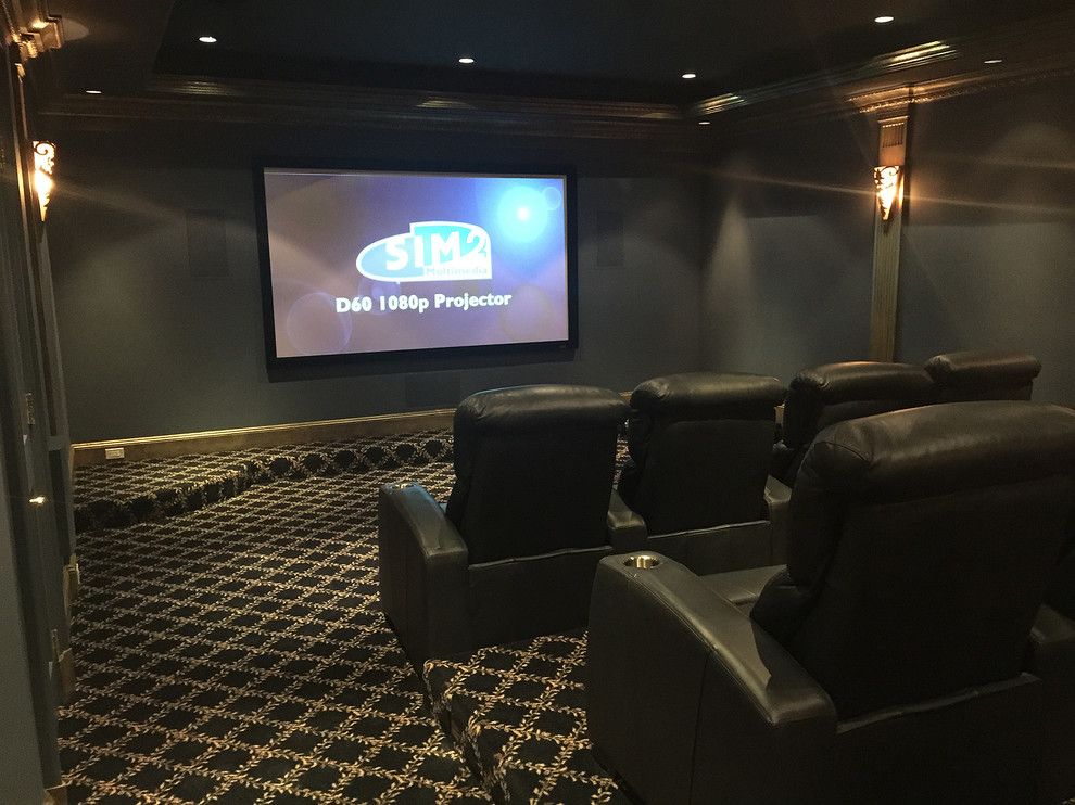 Large trendy enclosed carpeted home theater photo in New York with black walls and a projector screen