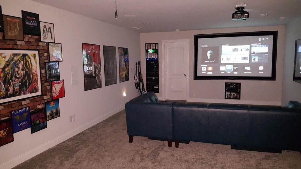 Photo of a medium sized modern enclosed home cinema in Raleigh with grey walls, carpet, a projector screen and grey floors.