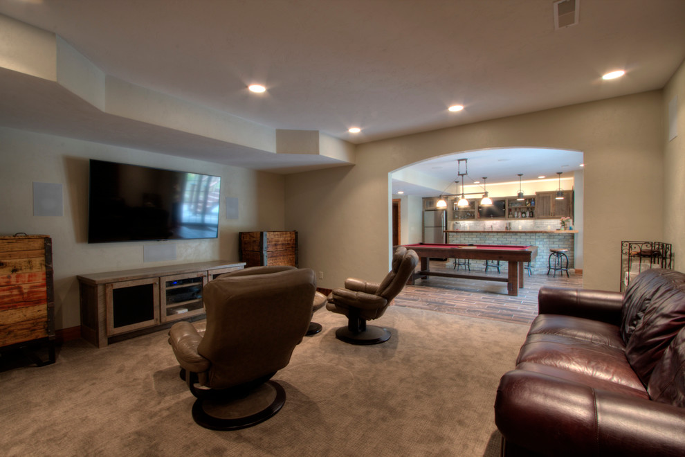 Rustic open plan home cinema in Milwaukee with carpet and a wall mounted tv.