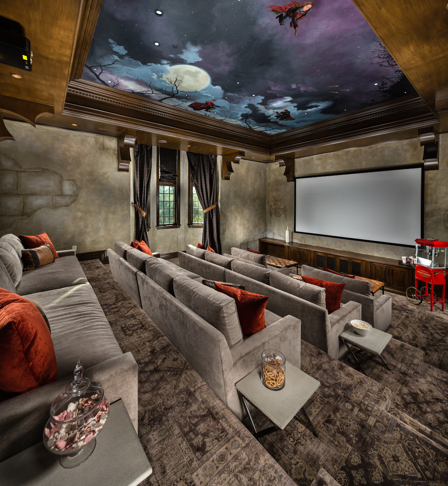 Huge tuscan enclosed carpeted and gray floor home theater photo in Los Angeles with a projector screen and gray walls