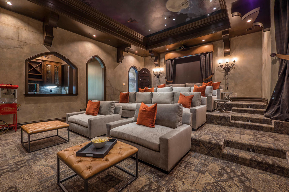 This is an example of a mediterranean enclosed home cinema in Los Angeles with brown walls, carpet, a projector screen and brown floors.