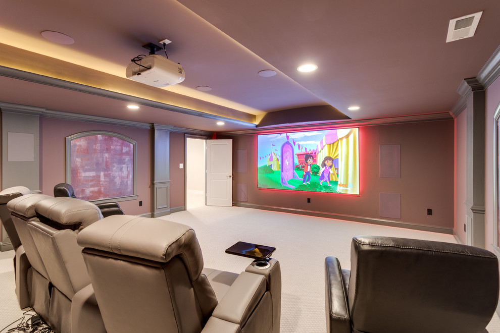 This is an example of a traditional enclosed home cinema in DC Metro with purple walls, dark hardwood flooring, a projector screen and brown floors.
