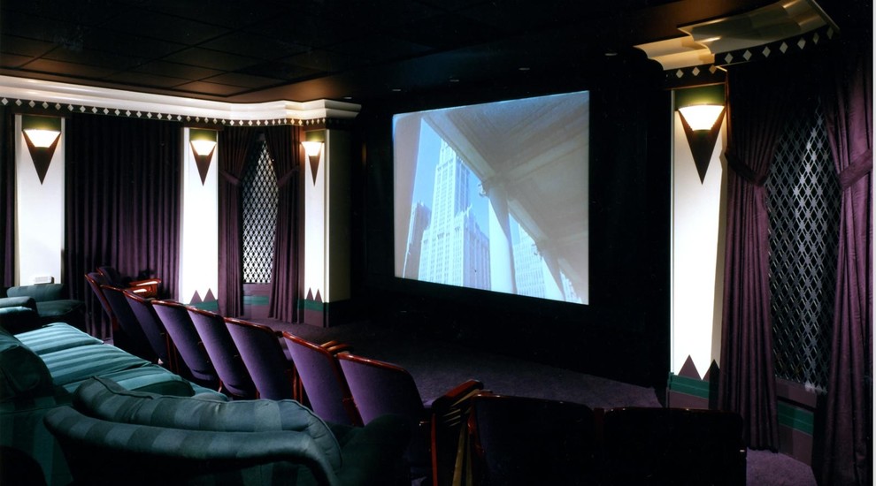Inspiration for a large timeless enclosed carpeted home theater remodel in Chicago with a projector screen