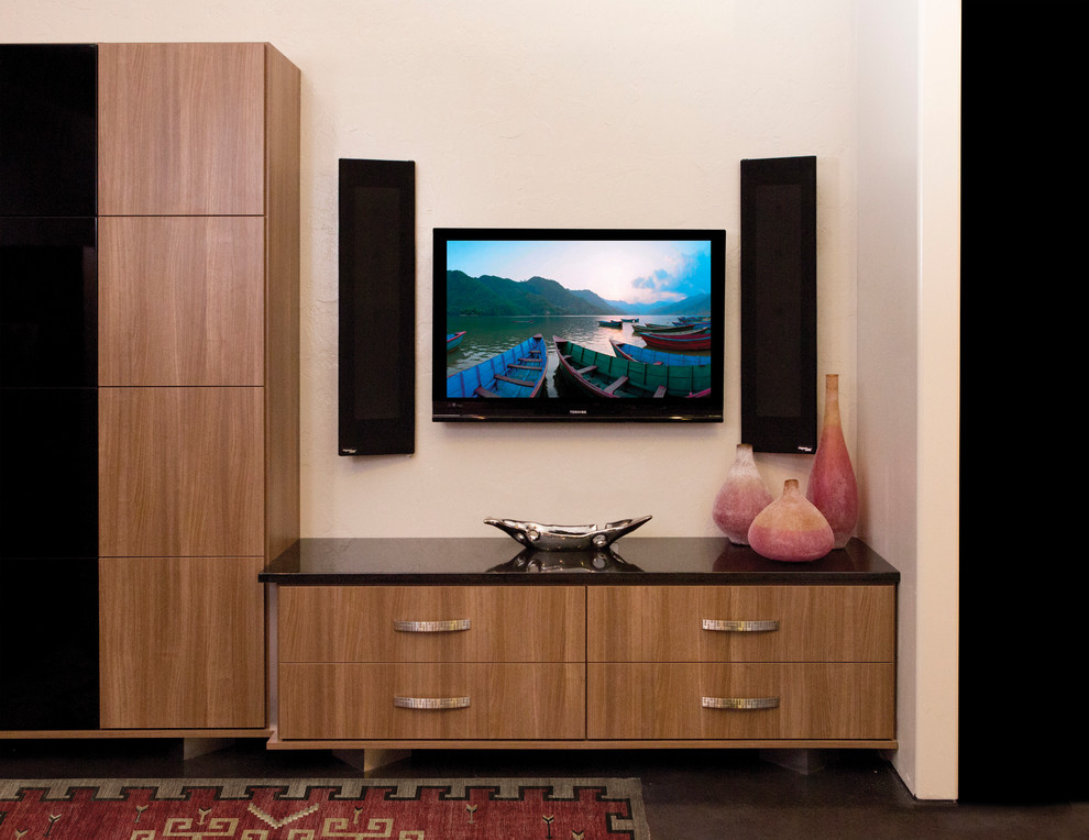 This is an example of a medium sized open plan home cinema in San Francisco with beige walls and concrete flooring.