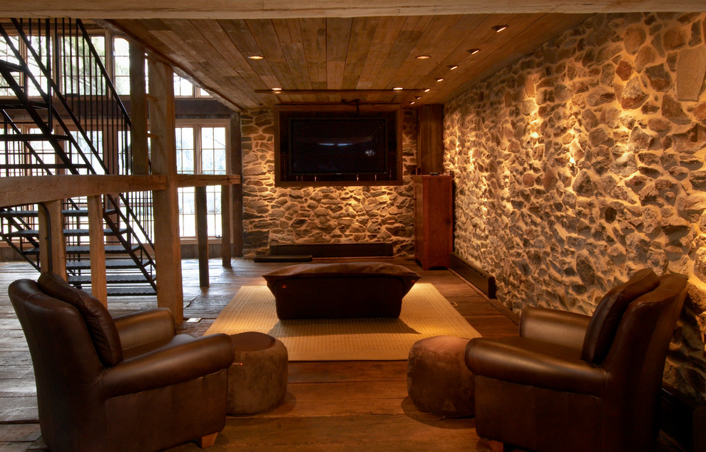 Example of a large mountain style open concept medium tone wood floor home theater design in Philadelphia with beige walls