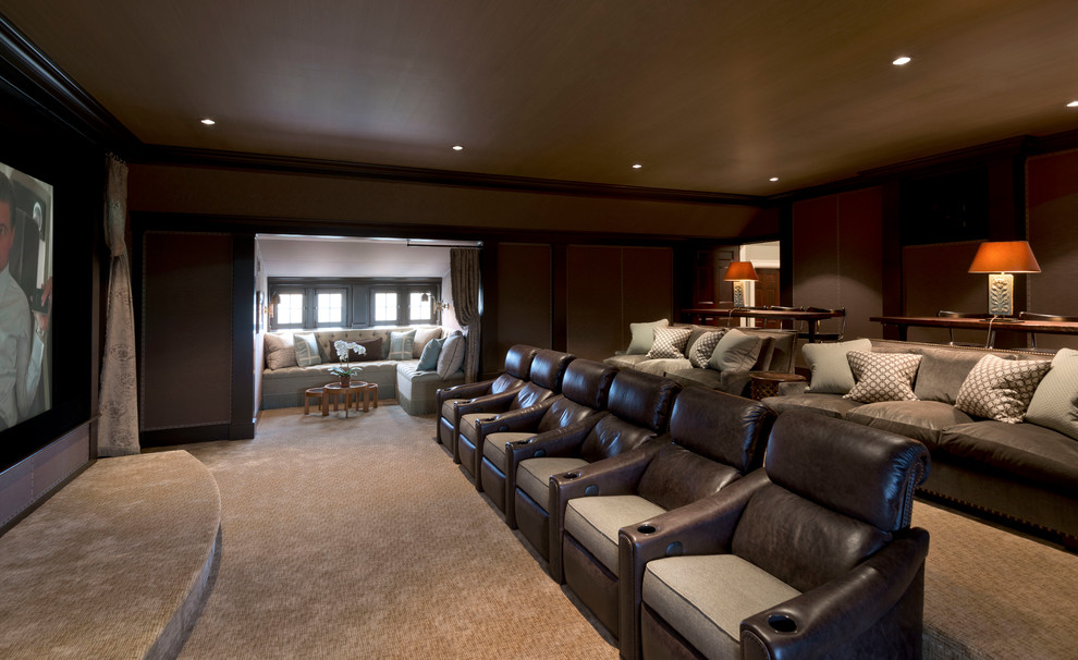 Large elegant enclosed carpeted home theater photo in New York with a media wall
