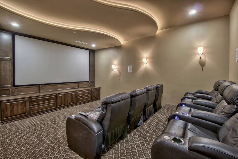Inspiration for an expansive classic enclosed home cinema in Phoenix with beige walls, carpet, a built-in media unit and multi-coloured floors.