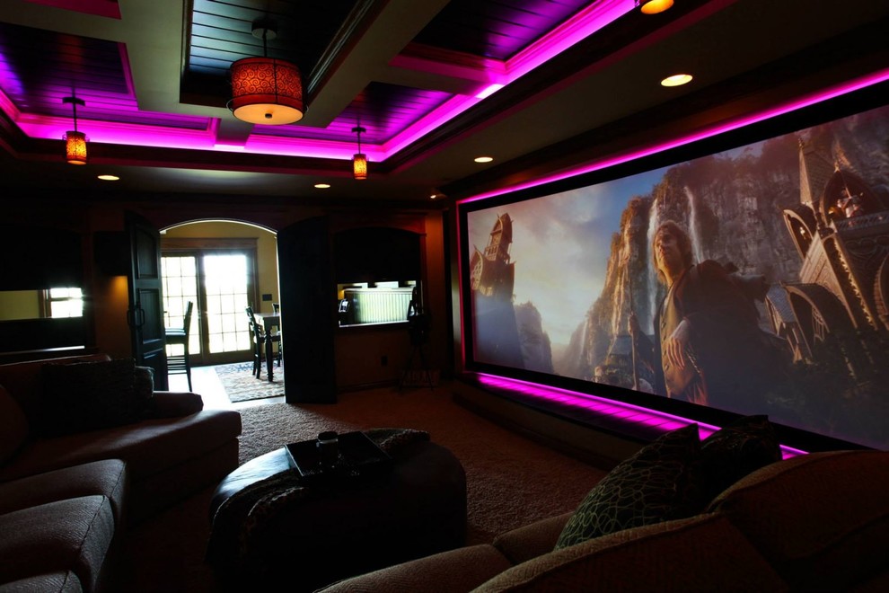 Mid-sized elegant enclosed carpeted home theater photo in Grand Rapids with a projector screen