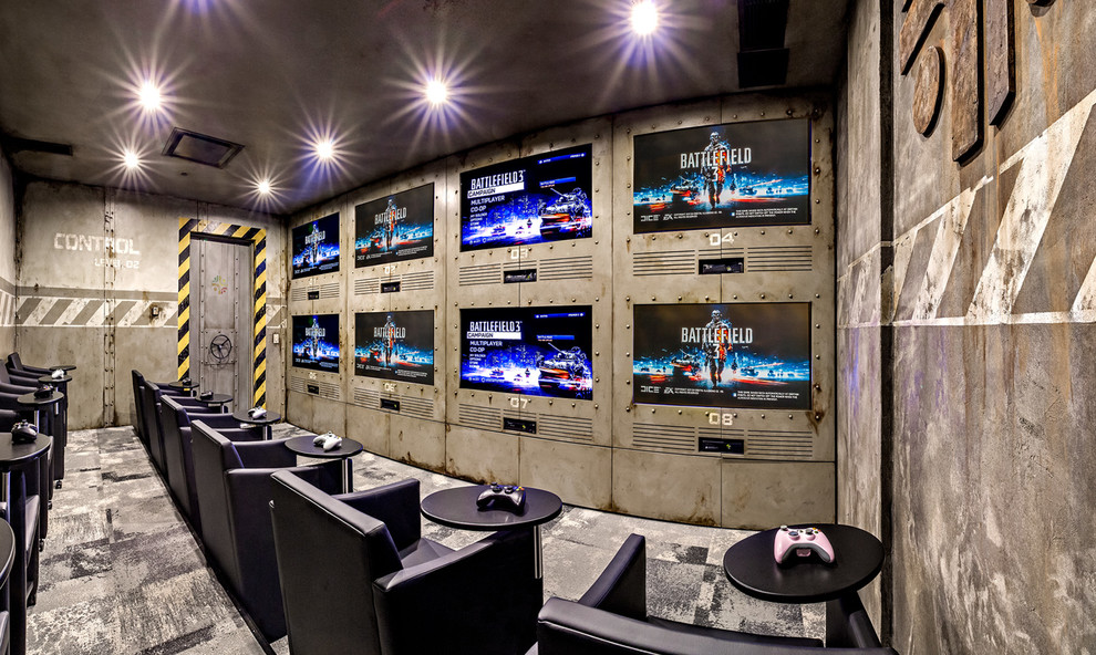 Idée de décoration pour une salle de cinéma design de taille moyenne et fermée avec un mur multicolore, moquette et un téléviseur encastré.