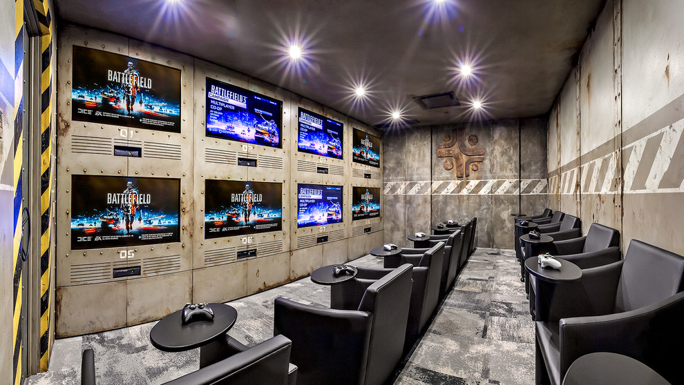Inspiration for a medium sized industrial enclosed home cinema in Calgary with multi-coloured walls, carpet, a built-in media unit and a feature wall.